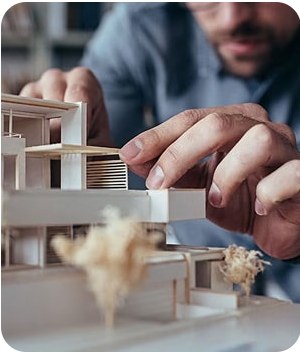 Architect adjusting a scale model